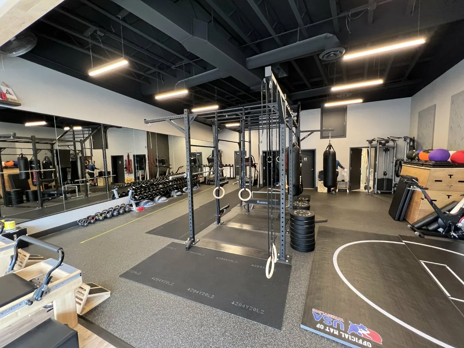Open strength training area in the studio